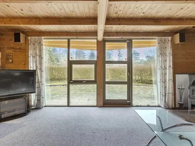 an open living room with sliding glass doors at Holiday Home Tally - 800m to the fjord by Interhome in Løgsted