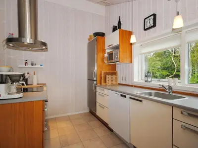a kitchen with a sink and a counter top at Holiday Home Evelina - 150m to the fjord by Interhome in Løgsted