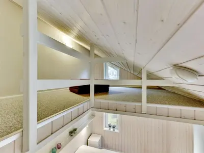 a large room with white walls and a ceiling at Holiday Home Anethe - 100m to the fjord by Interhome in Løgstør