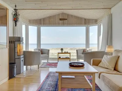 a living room with a view of the ocean at Holiday Home Yorrick - 50m to the fjord by Interhome in Løgstør
