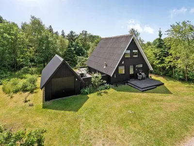 an overhead view of a black house on a grass field at Holiday Home Jütte - 2km to the fjord by Interhome in Farsø