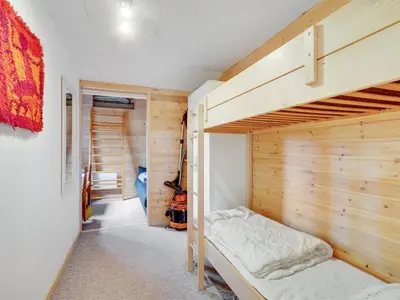 a bedroom with a bunk bed in a room at Holiday Home Magh by Interhome in Års