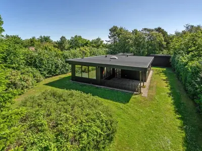 a modern house with a black roof at Holiday Home Ludde - 500m to the fjord by Interhome in Løgstør