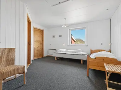 a bedroom with two beds and a window at Holiday Home Alvira - 8km to the fjord by Interhome in Fjerritslev