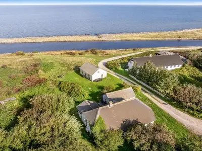an aerial view of a house and the water at Holiday Home Agrippa - 30m to the fjord by Interhome in Løgstør