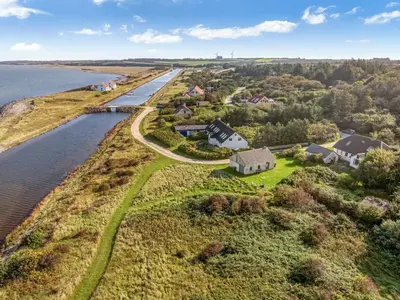 an aerial view of a house on an island next to a river at Holiday Home Agrippa - 30m to the fjord by Interhome in Løgstør