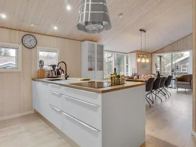 a kitchen with a sink and a counter top at Holiday Home Sighbiorn - 950m from the sea by Interhome in Fjerritslev