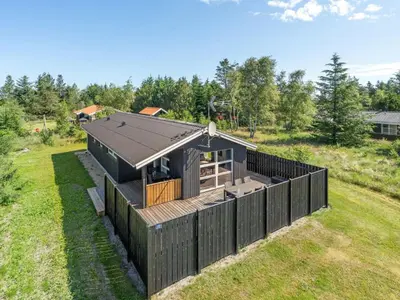 an overhead view of a house with a black fence at Holiday Home Ordan - 800m from the sea by Interhome in Fjerritslev