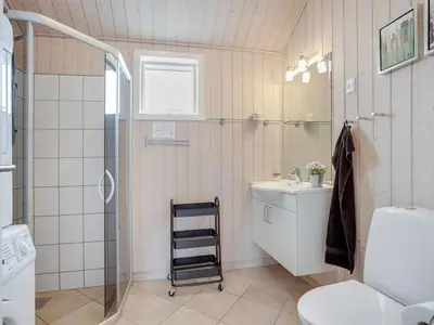 a bathroom with a shower and a toilet and a sink at Holiday Home Henriete - 3-5km from the sea by Interhome in Fjerritslev