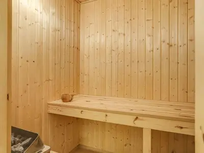 a wooden sauna with a cup on a shelf at Holiday Home Gunnie - 1-1km from the sea by Interhome in Fjerritslev