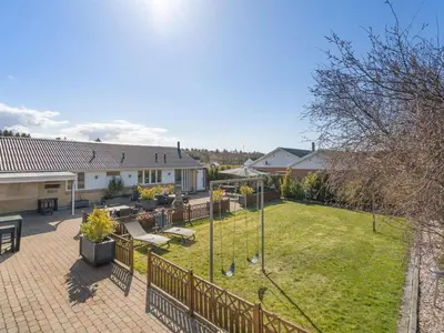 a backyard with a swing set and a lawn at Holiday Home Bitta - 500m from the sea by Interhome in Fjerritslev