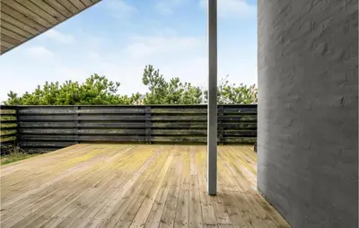 a room with a wooden floor and a wall at Amazing Home In Thisted With Sauna in Torsted