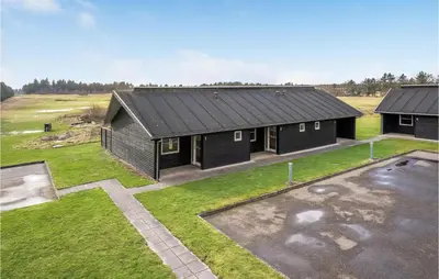 an aerial view of a black house with a yard at Lovely Home In Pandrup With Kitchen in Pandrup