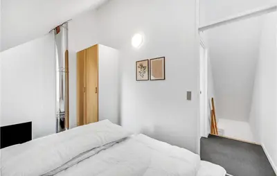 a bedroom with white walls and a bed at Cozy Home In Lemvig With Wifi in Lemvig