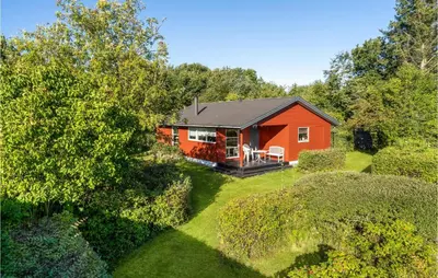 an aerial view of a red house with a yard at Amazing Home In Nykøbing M in Hesselbjerg