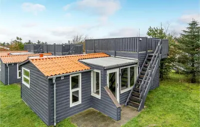 a tiny house with a staircase on the side of it at Beautiful Home In Hanstholm With Wifi in Hanstholm