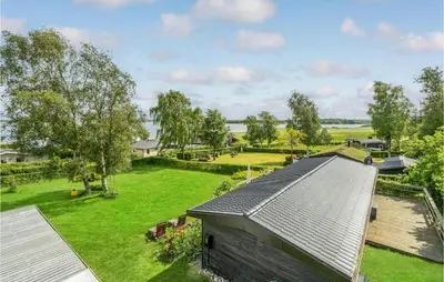 an aerial view of a house with a yard at Stunning Home In Roslev With Kitchen in Roslev