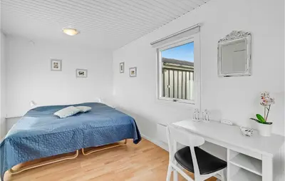 a bedroom with a bed and a desk and a window at Amazing Home In Vinderup With Wifi in Vinderup