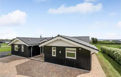 a house with a black exterior at Beautiful Home In Vinderup With Sauna in Vinderup