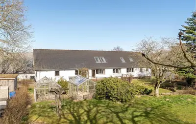 a house with a garden with two glass greenhouse at Gorgeous Home In Højslev With Wifi in Højslev