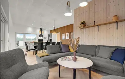 a living room with two couches and a table at Beautiful Home In Spøttrup With Wifi in Spottrup