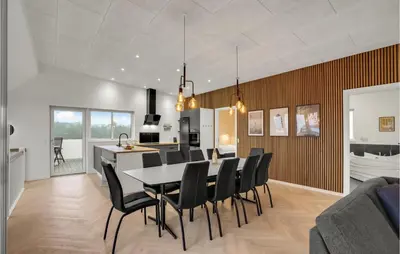 a dining room and kitchen with a table and chairs at Beautiful Home In Spøttrup With Wifi in Spottrup