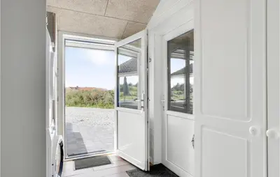 a door to a room with a view of a yard at Cozy Home In Vestervig With Wifi in Vestervig