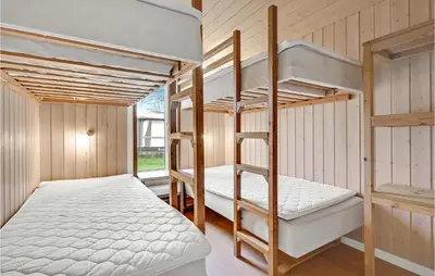 a bunk bed room with two bunk beds in it at Gorgeous Home In Hanstholm With Wifi in Hanstholm