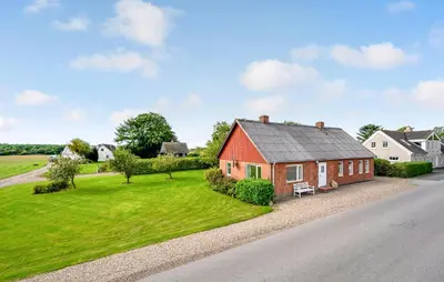an aerial view of a red house with a yard at 2 Bedroom Gorgeous Home In Roslev in Roslev