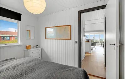 a bedroom with a bed and a door to a hallway at Cozy Home In Hurup Thy With Wifi in Doverodde