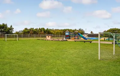 a park with a playground with a goal at 1 Bedroom Nice Home In Vestervig in Vestervig
