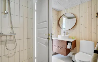 a bathroom with a shower and a toilet and a sink at Lovely Home In Thisted With Sauna in Thisted