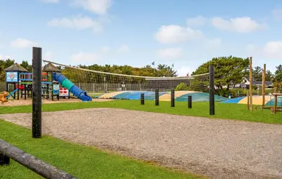 a playground with a slide and swings at Cozy Home In Vestervig With Kitchen in Vestervig