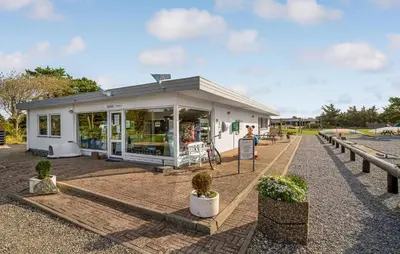 a small white building with plants in front of it at Cozy Home In Vestervig With Kitchen in Vestervig