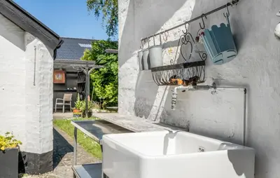 a white sink on the side of a building at 2 Bedroom Stunning Home In Bedsted Thy in Bedsted Thy