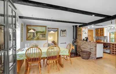 a kitchen and dining room with a table and chairs at 2 Bedroom Stunning Home In Bedsted Thy in Bedsted Thy