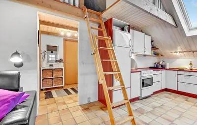 a ladder in a kitchen with a refrigerator at Stunning Home In Roslev With Kitchen in Roslev