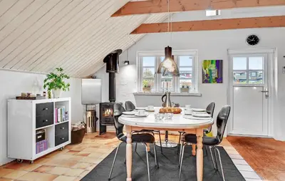 a kitchen and dining room with a table and chairs at Stunning Home In Roslev With Kitchen in Roslev