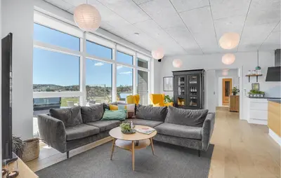 a living room with a couch and a table at Lovely Home In Thisted With Wifi in Thisted