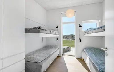 two beds in a white room with a window at Lovely Home In Thisted With Wifi in Thisted