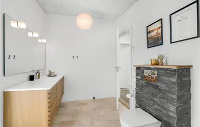 a bathroom with a sink and a toilet at Lovely Home In Thisted With Wifi in Thisted