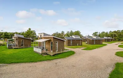 a row of modular homes on a green lawn at Gorgeous Home In Vestervig With Kitchen in Vestervig