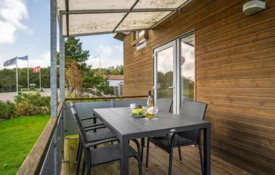 a table and chairs on the balcony of a house at Lovely Home In Vestervig With Kitchen in Vestervig