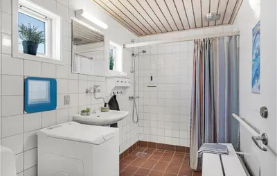 a bathroom with a toilet and a sink and a shower at Beautiful Home In Pandrup With Wifi in Pandrup