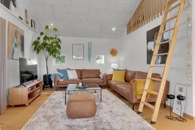 a living room with a couch and a ladder at Beautiful Home In Blokhus With 1 Bedrooms in Blokhus