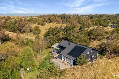 an overhead view of a house with a solar roof at Beautiful Home In Blokhus With 1 Bedrooms in Blokhus