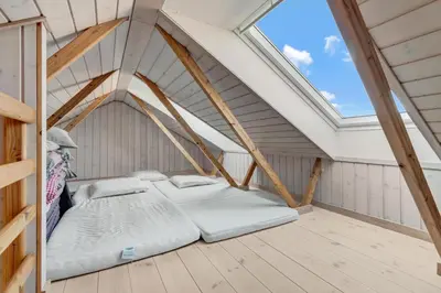 a bed in a room with a roof at Beautiful Home In Pandrup With 2 Bedrooms And Wifi in Pandrup