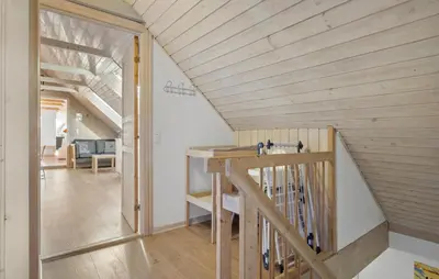a staircase in a house with a wooden ceiling at 2 Bedroom Gorgeous Apartment In Pandrup in Pandrup