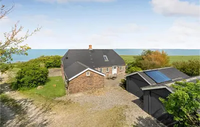 an overhead view of a house with a black roof at Beach Front Home In Lemvig With Wifi in Lemvig