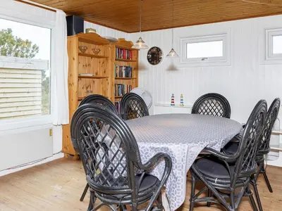 a dining room with a table and chairs at 6 person holiday home in Thisted-By Traum in Torsted